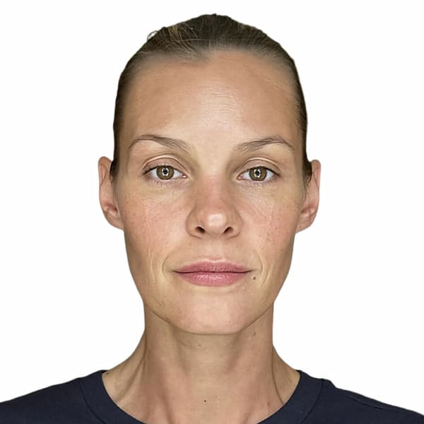 After: the same photo corrected to a compliant passport photo — plain white background, centered, even lighting